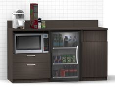 a microwave, refrigerator and coffee maker in a room with white tiles on the walls