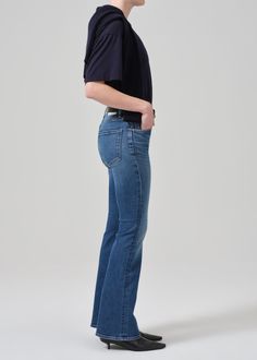 Channeling the sophistication of 70’s glamour, the Lilah offers a modern take on the decade defining fit. Designed to elongate the legs, this fit is flatteringly slim through the thighs before kicking out to flared hems. For a shorter inseam, shop the Lilah High Rise Bootcut 30". This fit is true to size. Looks Like: Medium indigo with fading and light whiskeringFeels Like: Signature soft stretch cotton with a smooth finish From our HUMANITY Collection Modern Fitted Bottoms, Modern Fitted Flare Bottoms, Modern Full-length Flare Jeans For Fall, Modern Full Length Fitted Bottoms, Modern Fitted Flare Jeans, Modern Fitted Straight Leg Bottoms, Fitted Flare Jeans With Standard Cut Leg For Spring, Classic Full-length Flare Jeans For Fall, Classic Full Length Flare Jeans For Fall