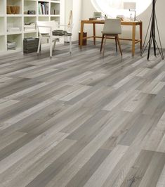 a living room with grey wood floors and white furniture in the background is a bookcase