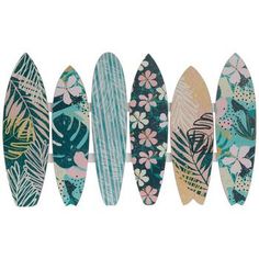 five surfboards lined up in a row with flowers and leaves on the top one