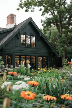 an image of a house that is surrounded by flowers