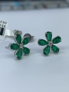 Metal...........14k white gold ( pure gold)Flower design Handmade in USA Emerald weight......2.20CT( set )Diamond weight.......0.8CTNatural clean stoneEarring Width ........11.2mmPush back Earrings Prong setting Sterling Silver Flower Earrings Fine Jewelry, Formal Sterling Silver Flower Earrings, Sterling Silver Flower Earrings For Formal Occasions, Silver Platinum Cluster Earrings As Gift, 14k Gold Cluster Earrings In White Gold, Sterling Silver Flower Earrings For Anniversary, 14k White Gold Flower-shaped Diamond Earrings, Luxury Sterling Silver Flower Shape Diamond Earrings, Cluster Earrings In 14k White Gold