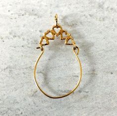 This vintage solid 14k gold charm holder pendant will hold all your favorite charms!  Create your very own version of a "penca de balangandan", the traditional charm cluster from Brazil. The pendant measures approximately 1 1/2" tall by 3/4" at the widest point, and five diamond-cut hearts form the top arch. It is in excellent condition, with a slight bend to the lower portion due to regular use. It won't be visible once charms are added. The bail will fit chains up to 2.5 mm wide. This charm ho Brass Heart Pendant Jewelry With Charms, Brass Heart Pendant Charms Jewelry, Brass Heart Charm Pendant Jewelry, Teardrop Charms Jewelry For Anniversary, Brass Charms Jewelry For Anniversary, Traditional Gold Jewelry With Heart Charm, Heart Charm Dangle Jewelry In Brass, Brass Heart Charm Dangle Jewelry, Teardrop Brass Jewelry With Dangling Charms