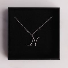 "Silver N Pendant / Silver letter N Necklace / Dainty silver chain necklace / initial necklace / sterling silver chain / personalized jewelry Dainty \"N\" initial. Perfect every day necklace. Lovely gift for your self, sister, bridesmaids, new mom. Convo me if you would like to customize the length of the chain. The possibilities are endless. Pendant: Base metal is brass and silver plated. Chain is 18 inches, sterling silver. (if you would like a longer or shorter chain, please contact us to cus Silver Monogram Charm Necklace For Mother's Day, Minimalist Monogram Initial Necklace In White Gold, Silver Charm Necklaces With Initials For Personalized Gift, Personalized Silver Charm Necklaces With Initials, Minimalist White Gold Monogram Initial Necklace, Personalized Silver Monogram Charm Necklace, Personalized Monogram Silver Charm Necklace, Silver Initial Necklace In Sterling Silver, Silver Monogram Initial Necklace For Mother's Day