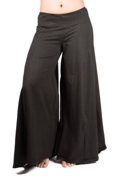 "Palazzo style pant, fitted at waist via elastic, flows out in an A-shape. Stretchy and comfortable. Long inseam and long legged. Looks like a skirt! Free flowing and wonderful to dance in. Pair with one of our crop tops for a classic Mishu style outfit! Approximate measurements: XS: Inseam: 29\" Hip: 34-40\" Waist:28-32\" Length 39\" S: Inseam: 30\" Hip: 36-42\" Waist:30-36\" Length 39\" M: Inseam: 31\" Hip: 38-46\" Waist: 32-40\" Length 39\" L: Inseam: 31\" Hip: 42-48\" Waist: 34-42\" Length 4 Relaxed Fit Full Length Bottoms, Full-length Stretch Pants With Elastic Waistband, Stretch Full-length Pants With Elastic Waistband, Fall Yoga Pants With Loosely Fitted Hips, Versatile Full-length Relaxed Fit Pants, Fall Wide-leg Stretch Yoga Pants, Versatile Full Length Pants With Elastic Waistband, Versatile Full-length Pants With Elastic Waistband, Fall Stretch Wide Leg Full Length Pants