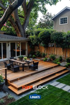 a wooden deck surrounded by plants and trees in front of a house with the words tuff block above it