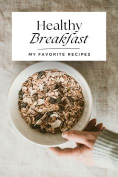 a person holding a plate with granola on it and the title reads healthy breakfast my favorite recipes