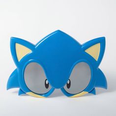 a close up of a toy sonic the hedgehog head on a white surface with no background