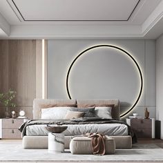 a modern bedroom with a circular light above the bed, and an ottoman on the floor