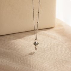 Our Labradorite & Moonstone Drop Necklace showcases the deep, earthy tones of the Labradorite Quartz and the milky, iridescent glow of the Moonstone. This unique blend of stones captures the essence of the earth and the moon, embodying grounded elegance and celestial charm. Perfect for day or night, this enchanting necklace adds a touch of natural elegance to any outfit ✨ SKU: RR-NR204 Product Details Material: High Quality Solid 925 Sterling Silver Finish: 18K Gold ∙ Sterling Silver Featuring a Minimalist Moon Phase Jewelry For Healing, Elegant Moon Phase Necklace For Healing, Elegant Labradorite Necklaces With Birthstone, Minimalist Necklace With Moon Charm For Healing, Elegant Labradorite Jewelry With Moon Charm, Elegant Labradorite Moon Phase Jewelry, Minimalist Moonstone Necklace With Moon Phase, Labradorite Moon Phase Pendant Necklaces, Labradorite Moon Phase Pendant Necklace