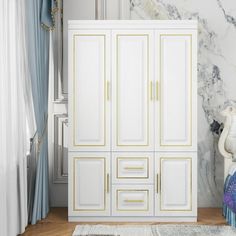 a white and gold armoire in a room with marble walls, rugs and curtains