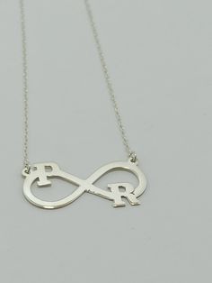 Color: silver Chain: .925 Silver Length: 18 inc (45 cm) Pendant size: 3.5 cm/1.6 cm Material: 925 Sterling Silver Weight:3.50 grams 925 sterling silver , infinity latter silver necklace loved necklace. İt can be to letters Two letters or numbers can be written on this infinite symbol necklace. It has a hard structure. It is resistant to breakage and you can use it for many years. The chain is 925 silver and very sturdy. Infinity Letter Necklace, Infinity Necklace, Personalized Infinity Initial N Sterling Silver Infinity Necklace In White Gold, Silver Infinity Jewelry Gift For Mom, Sterling Silver Infinity Necklace For Anniversary, Elegant Silver Infinity Name Necklace, Elegant Silver Nickel-free Name Necklace, Silver Infinity Name Necklace, Silver Engraved Infinity Necklace, Infinity Name Necklace For Anniversary, Silver Infinity Necklace For Anniversary