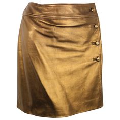 - Chanel bronze metallic lambskin leather wrap skirt from Fall 1996 collection. - Featuring four bronze metallic "CC" buttons down the side and a hook on the side closure. - Lined w CC lining. - Made in France. - Size 40. - Waist: 28 inches. Length: 15.5 inches. - 100% Lambskin. Double Lining: 100% Silk. Leather Wrap Skirt, Skirt Chanel, Brown Leather Skirt, Olive Skirt, Chanel Skirt, Leather Skirt Outfit, Skirt Wrap, Button Up Skirts, Wrap Skirts