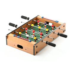 a foosball table top soccer game on a white background