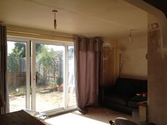 an open living room with sliding glass doors