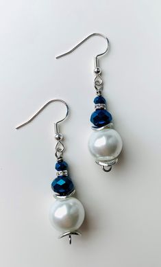 Pearl and Navy dangle earrings! Sparkles when it catches the light. Thank you for stopping by! Party Jewelry With French Hook Dangle, Elegant Beaded Drop Earrings With French Hook, Elegant Beaded Earrings With French Hook As Gift, Earrings Patterns, Beaded Earrings Patterns, Earring Patterns, Etsy Earrings Dangle, Ear Jewelry, The Light