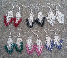 six pairs of dangling earrings are on the ground