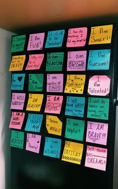 a refrigerator covered in sticky notes and magnets