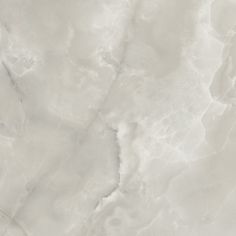 a white marble textured background with some black spots