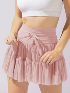 This pleated skirt will give you a high waisted look with its lace-up panel detail. And with built-in shorts, you'll feel confident and covered while still rocking the trend. Perfect for a flirty and chic look! Dirndl Outfit, Athletic Skirts, Strapless Tube Dress, Trendy Spring Outfits, Bandeau Tops, 1920s Flapper Dress, Short Denim Skirt, Plunge Dress, Short Playsuit