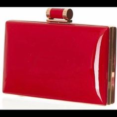 This Patent Pill Box Clutch Made Its Debut At The Oscars On The Red Carpet Worn By Academy Award Winning Actress Rachel Weisz. This Fashionable Clutch Can Be Dressed Up Or Worn Casually With Plenty Of Room For Your Day To Evening Essentials. Detachable Chain Included. Available Colors: Black And Egg Shell A Carrie Ella Exclusive! Chic Rectangular Clutch For Office, Square Red Clutch, Classic Square Evening Clutch, Chic Red Rectangular Evening Bag, Elegant Red Square Evening Bag, Red Evening Bag With Gold-tone Hardware, Elegant Red Rectangular Case Bag, Formal Square Clutch With Gold-tone Hardware, Chic Red Clutch With Gold-tone Hardware