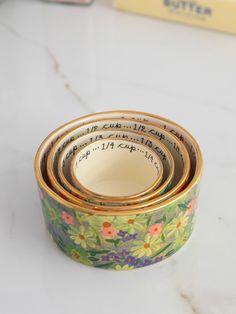 three rolls of decorative paper with writing on them