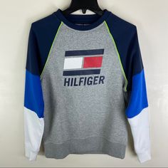 Brand New With Tag. Sport Series. Made In India. Blue Color Block Sweatshirt Athleisure Style, Casual Blue Tops With Logo Detail, Sporty Gray Crew Top, Tommy Hilfiger Casual Sports Tops, Gray Athleisure Sweatshirt With Logo Print, Gray Sporty Sweatshirt With Logo, Sporty Gray Color Block Tops, Tommy Hilfiger Sporty Top With Ribbed Cuffs, Sporty Gray Sweatshirt With Logo