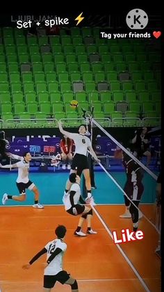 a group of people on a court playing volleyball