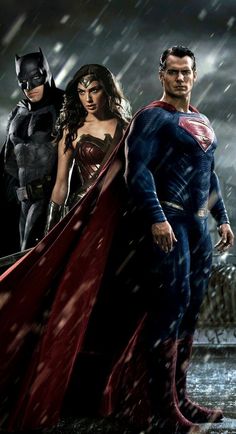 the man and woman are standing together in the rain with superman's cape on