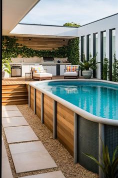 an outdoor swimming pool with steps leading up to it and a grill in the background