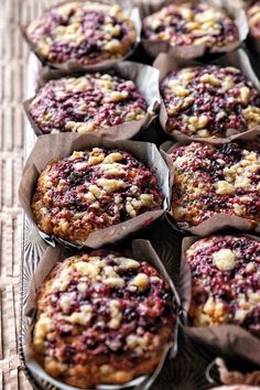 muffins with cranberry topping sitting on a tray