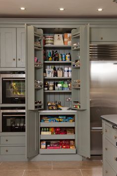 an open pantry in the middle of a kitchen