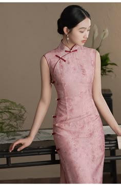 Indulge in the exquisite elegance of this pink Cheongsam dress. Featuring sleeveless design and a traditional mandarin collar, this ankle-length dress is adorned with two subtle side slits, creating a timeless and sophisticated silhouette, perfect for any special occasion. Size Guide: Please refer to the size guide picture before placing the order. Please leave your Height, Weight Bust, Waist and Hip measurements in the Personalisation box so we could double check the size for you. Pink Qipao, China Clothes, Modern Cheongsam, Qipao Cheongsam, Modern Hanfu, Qipao Dress, Cheongsam Dress, Ankle Length Dress, Exotic Fashion