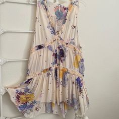 Nwt Free People Summer Dress, In Floral Patterns Of Color Combinations. Lines Of Ruffle Decorations Around, Very Pretty. Womens L Purple Bohemian Sundress With Floral Print, Summer Boho Print Purple Dress, Purple Boho Print Dresses For Summer, Summer Dresses In Purple With Boho Print, Purple V-neck Sundress For Spring, Spring Purple Boho Dress With Floral Print, Purple V-neck Spring Sundress, Spring Purple Floral Print Boho Dress, Flowy Purple Boho Dress With Floral Print