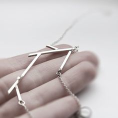 "Handmade sterling silver necklace from the \"Sticks\" collection. The geometrized twig follows the shape of the necklace. On each end of the twig the necklace continues with a delicate but strong chain and a hook and eye clasp. Length: 61cm (24\") Centrepiece: 7x2.5cm * Necklace comes with a hook and eye clasp. If you would like a spring ring/lobster clasp instead, just leave a note. Visit my shop: http://www.etsy.com/shop/jewelryMirta © MIRTA" Silver Surf, Oxidized Necklace, Silver Cleaner, Necklace Minimalist, Herkimer Diamond, Minimalist Necklace, Necklace Sterling Silver, Handmade Sterling Silver, Sterling Silver Necklace