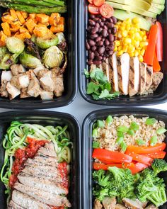 four plastic trays filled with different types of vegetables and meat on top of rice