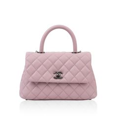 The Mini Coco Handle, crafted from soft pink, caviar leather, is the smallest of the collection - exuding the perfect mix of practical and stylish. Designed for hand held use or for over-the-shoulder wear with the very convenient removable strap. This Chanel may be a mini, but it comes with two compartments and includes two extra pockets. Chic and sweet, this Chanel is a delightful edition to any bag-lovers wardrobe. SPL Exterior  Baby pink caviar leather Ruthenium hardware Single flap with turnlock closure Signature CC clasp Top handle Removable shoulder strap Metal feet at base Slip pocket at rear of the bag Excellent condition  Interior  Baby pink lining Two divided compartments Inside zip pocket Chanel embossed logo Comes with dustbag, box, and ity card  SPL  Height 15.0cm Width 23.0cm Chanel Coco Handle, Handbags Chanel, Handbags White, Coco Handle, Man Bags, Purse White, Chanel Chanel, Chanel Purse, Leather Man