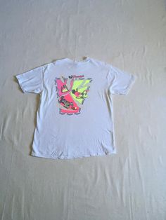 "vintage 1980s t-shirt Hanes Beefy T, made in USA 100% cotton single stitch white w/black/yellow/pink front/back print front breast-Freestyle Hawaii back center-Freestyle Hawaii w/images of boogie boarder riding light wear, light stains/pilling-see photos label size XL, see below measures, lying flat, shoulder-21 1/2\" sleeve-8 1/4\" chest-22\" length-29 1/2\"" Vintage White T-shirt For Summer, White T-shirt For Summer, 90s Style Pre-shrunk White T-shirt, Pre-shrunk White T-shirt For Beach, 90s Style White Short Sleeve T-shirt, 90s Style Pre-shrunk T-shirt For Summer, White Short Sleeve T-shirt With 90s Style, White Short Sleeve T-shirt 90s Style, Vintage White T-shirt With Graphic Design