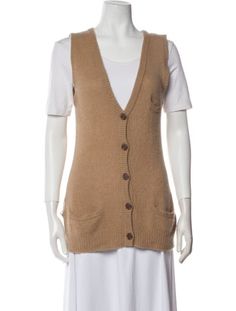 James Perse Cashmere CardiganBrownInterlocking CC LogoSleeveless with Plunge NecklineButton Closure at FrontDesigner size 2.Fit:Knitwear by James Perse typically fit true to size. Brown Knit V-neck Vest, Brown V-neck Vest With Buttons, Casual Sleeveless Brown Cardigan, Casual Brown Sleeveless Cardigan, Beige V-neck Vest With Buttons, Fall V-neck Sweater Vest With Button Closure, Brown V-neck Vest For Layering, Knit V-neck Sweater Vest With Buttons, Plunge Neckline