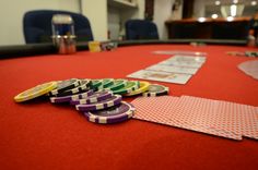 several poker chips are laying on the table