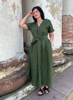 "Handmade washed linen mid-calf dress with short sleeves, pockets and belt. Made with love for You. *100% local medium weight linen *Suitable for maternity *Each item is individually cut and sewn by order *The model height is 172 cm *The model is wearing size M *The dress color - Dark moss green *Note that colors may look different on your display depending on their settings and technical characteristics. Please let us know if you need different measurements or colors. CARE *Machine wash up to 4 V-neck Linen Midi Dress With Belt, Belted Linen V-neck Midi Dress, Linen Belted V-neck Midi Dress, Belted V-neck Linen Midi Dress, Casual Linen V-neck Dress With Tie Waist, Short Sleeve Linen Dress With Tie Waist, Short Sleeve Linen Midi Dress With Belt, Belted Linen Midi Dress With Short Sleeves, Linen Belted Midi Dress With Short Sleeves