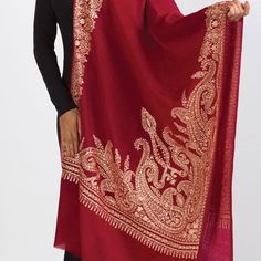 Our new Durga Embroidered Shawl features exquisite embroidery on soft 100% merino wool. With a stunning paisley design, this classically beautiful shawl showcases the intricate embroidery traditions of Northern India in rich gold tones on a burgundy red base. The high quality and elegance of these embroidered shawls make them treasures that will last for generations. Luxury Handloom Traditional Drape Shawl, Luxury Jamawar Pashmina Shawl For Traditional Ceremonies, Luxury Semi-stitched Handloom Shawl, Luxury Traditional Shawl Scarf, Luxury Elegant Shawl With Intricate Embroidery, Luxury Elegant Embroidered Pashmina Fabric, Luxury Dupatta Shawl With Motifs, Luxury Handmade Shawl For Gift, Shawl With Embroidered Border For Eid