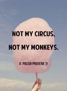 a person holding up a pink lollipop with the words not my circus, not my monkeys