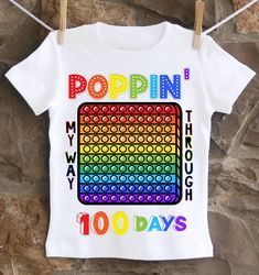 A fun, unique 100th day of school Pop It shirt. All shirts are 100% cotton.  I use a professional heat press to transfer the image, NOT a home iron.  I use high quality shirts from ARB Blanks.  These are very soft shirts, not thin undershirts. Please see the size chart below for the t-shirts and choose your options in the drop down menus. *Please note heat pressed shirts may become distressed through wash/wear.  Always wash them inside out on a delicate cycle using mild detergent and no bleach. 100 Day Of School, Heat Press Shirts, Outfits Baggy, School Gym, It Shirt, 100th Day Of School, School Fits, Pop It, 100 Days Of School