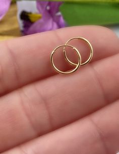 14K Solid Gold Hoop Earrings - 14K Endless Hoops, Hoop Earring, Small Hoops, Thin Hoop Earrings, Dainty Hoop, Dainty Gold Earrings. Dainty endless hoop earrings, simple and beautiful! These endless hoops are perfect for everyday wear. ✦Price is for a pair of earrings, if you only need please message me. ✦Endless hoops measure 10mm or 12mm and 14K yellow gold 🎁 Comes ready to gift in a gift box or bag. ♥BUY WITH CONFIDENCE♥ Please know I take customer service very seriously! There is nothing I w Small Gold Hoop Earrings Simple, Gold Tiny Hoop Earrings, Small Hoop Gold Earrings, Small Ring Earrings Gold, Simple Gold Round Earrings, Dainty Nose Ring, Minimalist Accessories Jewellery, Small Hoops Earrings, Simple Gold Hoop Earrings