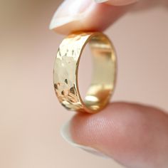 A chunky 6mm hammered gold vermeil ring, designed to make a statement. It's a fabulous gift to your best friend, family member or a minimalist addition to your own collection. Inspired by the tranquil sands and shallows of Agonda, Goa, the Agonda Chunky ring captures the various natural terrains of the area with its textured design. Our expert artisans have used the traditional metalworking technique of hammering to give the ring its texture. The Agonda Chunky ring is from the Agonda family. Its Hammered Wide Band Ring As Gift, Hand Forged Wide Band Ring For Gift, Hand Forged Wide Band Ring As Gift, Hand Forged Thick Band Wide Ring, Gold Hammered Thick Band Jewelry, Hammered Gold Jewelry For Promise, Gold Hammered Jewelry For Promise, Gold Hammered Promise Ring, Hammered Yellow Gold Promise Jewelry