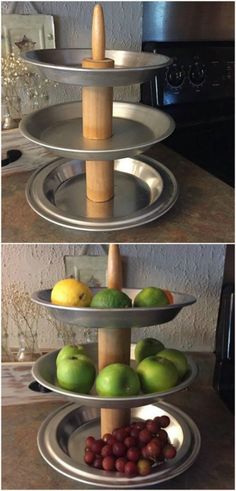 three tiered trays filled with fruit on top of a counter