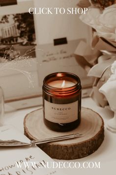 a candle sitting on top of a wooden slice