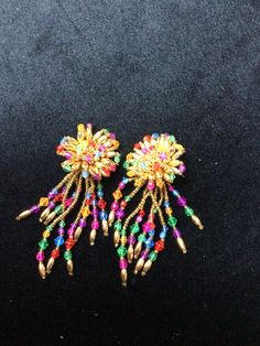 Very colorful clip earrings Bohemian Dangle Clip-on Earrings For Party, Vintage Multicolor Drop Clip-on Earrings, Beaded Drop Clip-on Earrings For Party, Vintage Multicolor Clip-on Earrings For Party, Bohemian Clip-on Jewelry For Parties, Rainbow Party Earrings With Colorful Beads, Multicolor Beaded Clip-on Earrings For Parties, Multicolor Bohemian Drop Clip-on Earrings, Clip-on Dangle Earrings Costume Jewelry