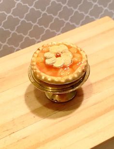 a pie sitting on top of a wooden table